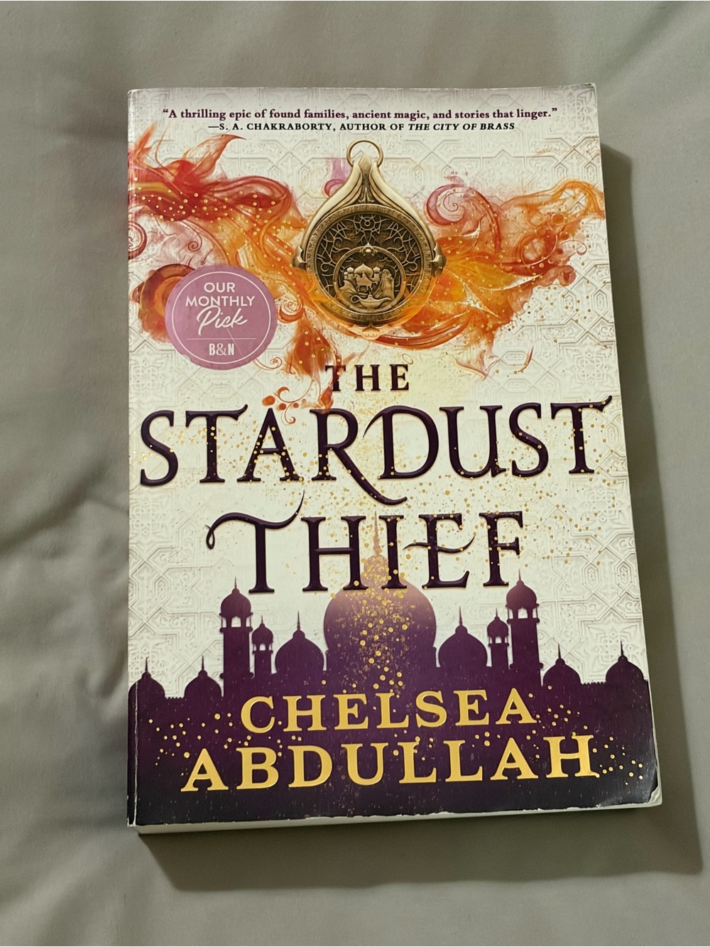 The Stardust Thief by Chelsea Abdullah - White & Purple Paperback